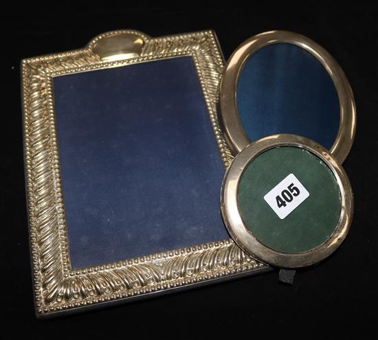 Three silver photograph frames.